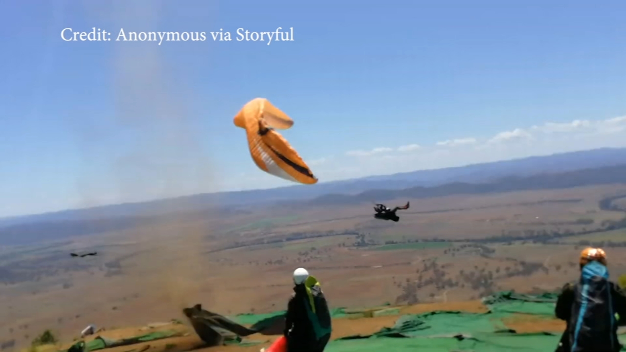 Video Dust devil sweeps up paraglider in Australia