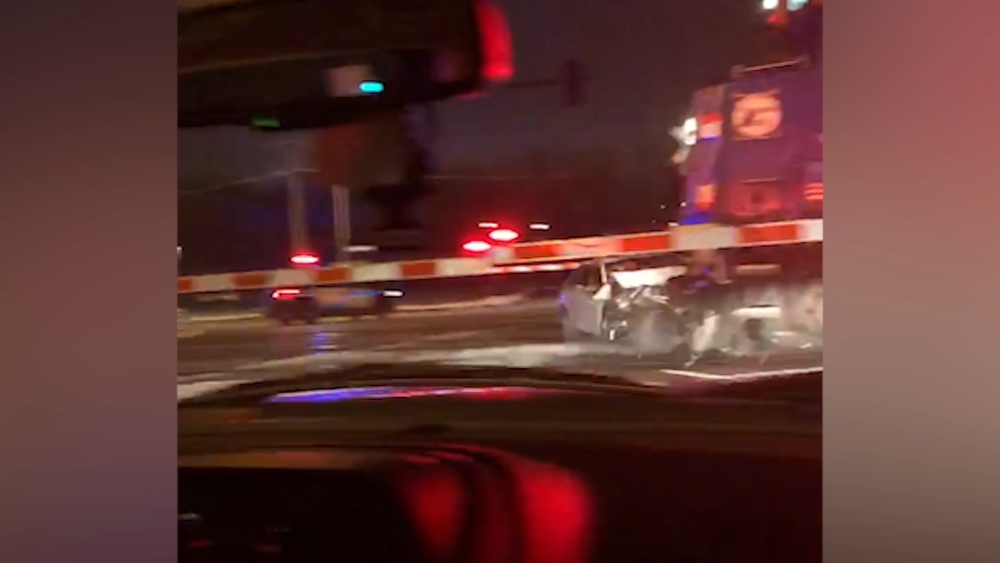 Woman, 96, rescued from car seconds before Metra trains hits