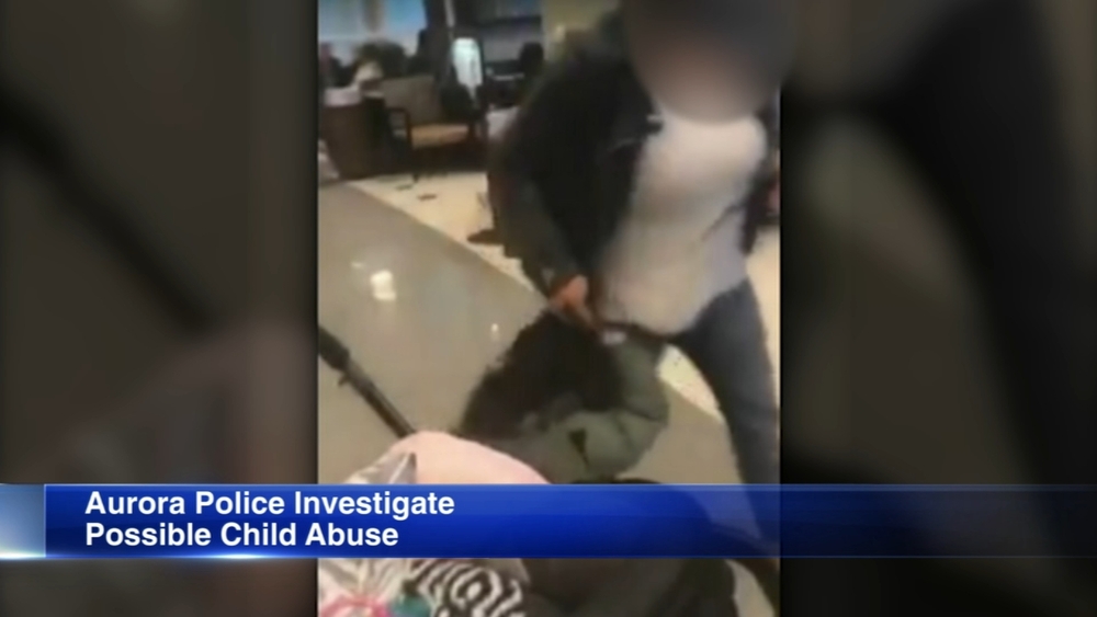 Aurora police investigate video of woman dragging child by hair
