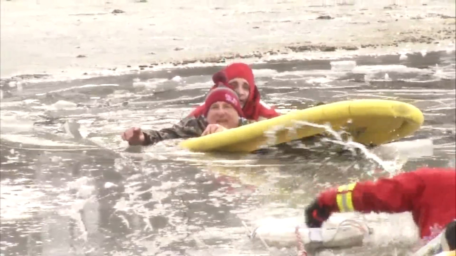 Man rescued from icy pond after risking life to save his dogs in ...