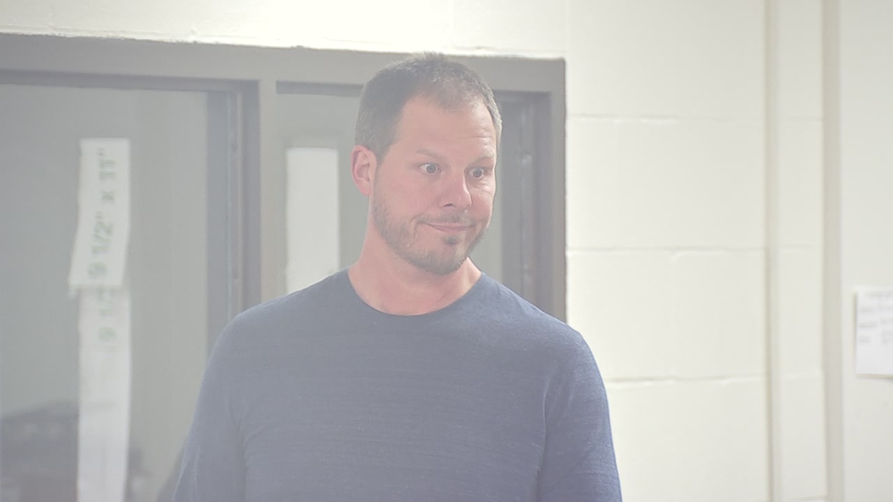 Man accused of trying to run over a security guard appears before judge