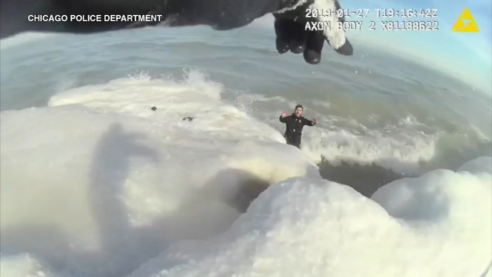 Bodycam captures CPD rescue of man in Lake Michigan using 'human chain'