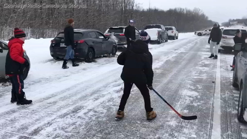 Drivers in Canada play hockey while stuck on highway