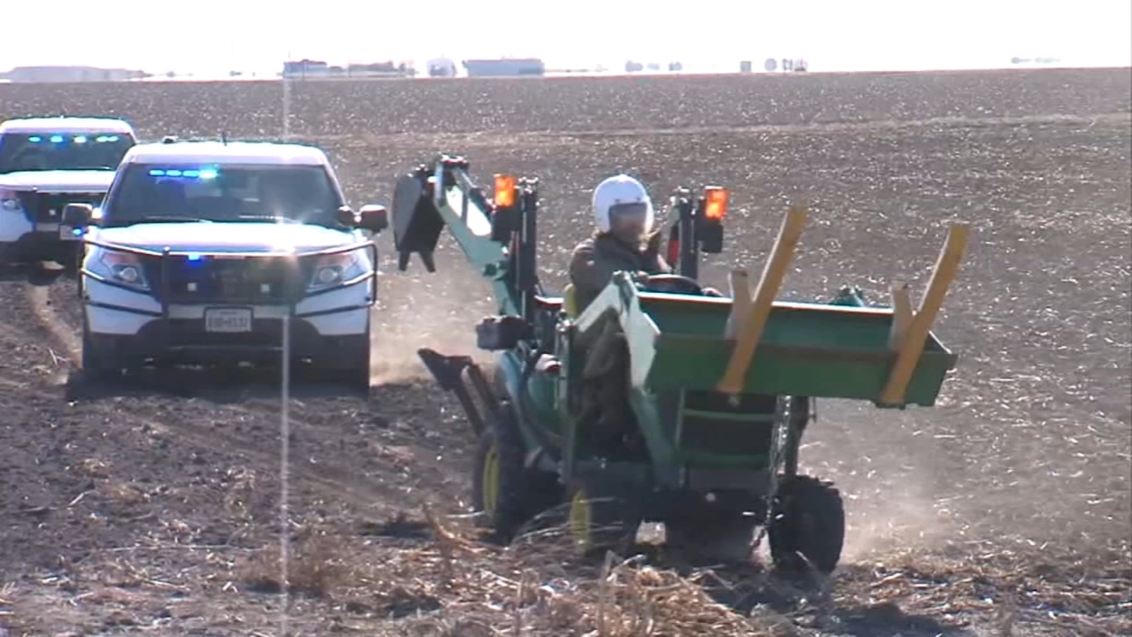 Alan Baade, charged with stalking, leads police on slowspeed tractor