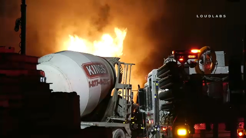 Row of cement trucks catch fire