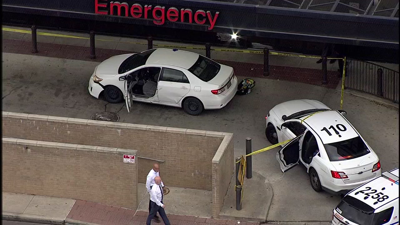Man shot in head while inside car with children