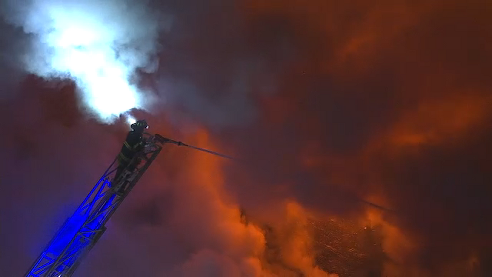Fire shoots from windows, roof of Newark apartment building