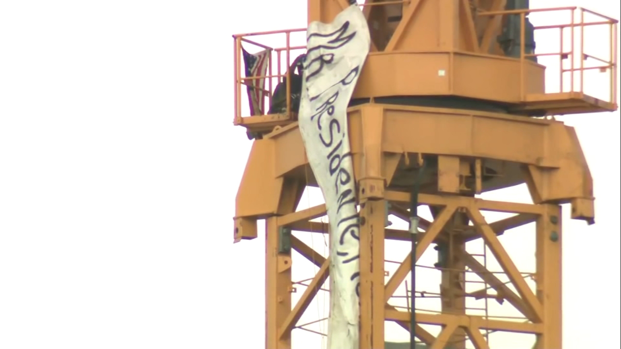 Man climbs crane in Florida ahead of Trump visit