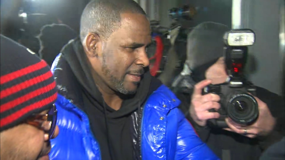 R. Kelly charged with 10 counts of sex abuse, in police custody