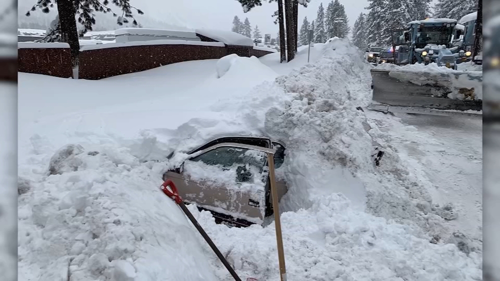 Snowplow driver finds woman alive inside car buried in snow