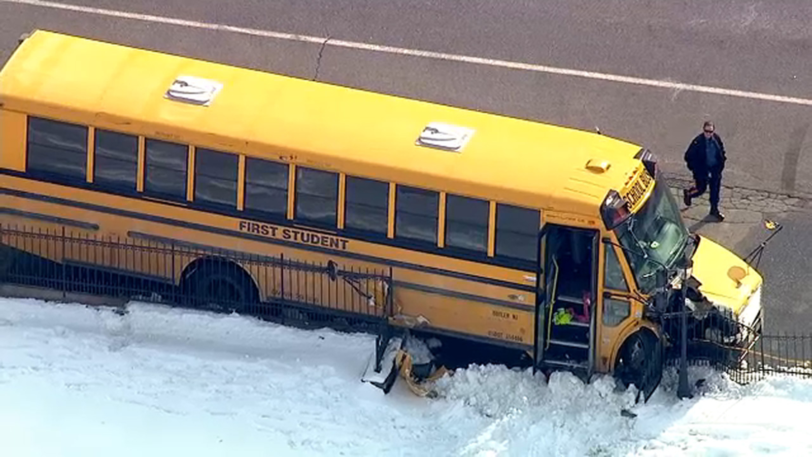 School bus with 18 kids on board crashes into pole, cemetery fence in