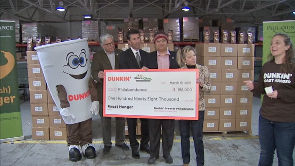 Philabundance gets check from 6abc Holiday Food Drive and Dunkin Donuts