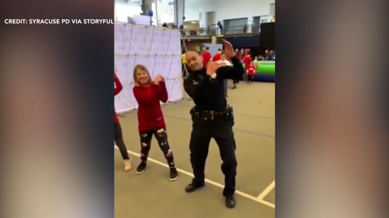 Dancing police officers show kids how it's done