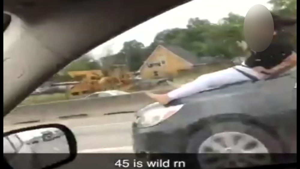 VIDEO: Woman's wild ride on car hood on I-45
