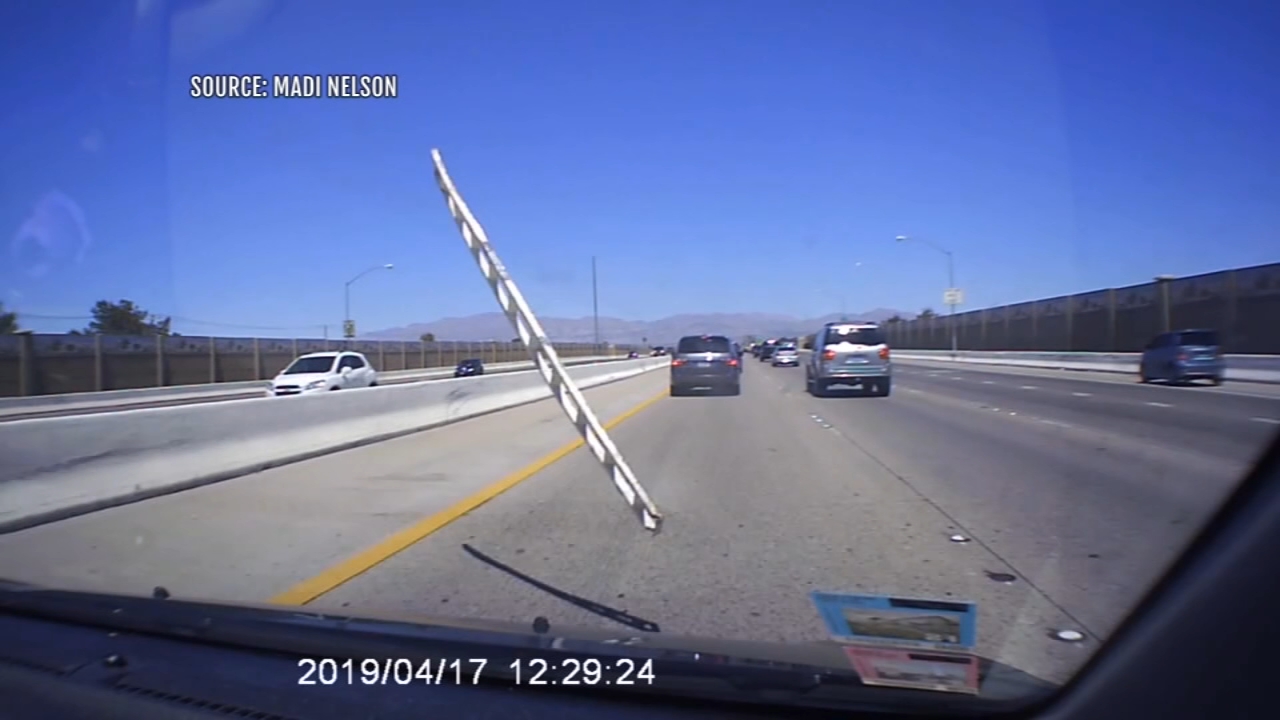 Flying ladder strikes woman's car