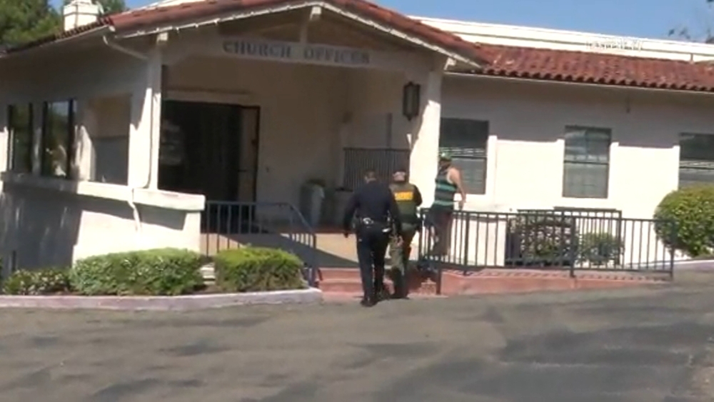 Woman holding gun and baby terrorizes San Diego church, police say