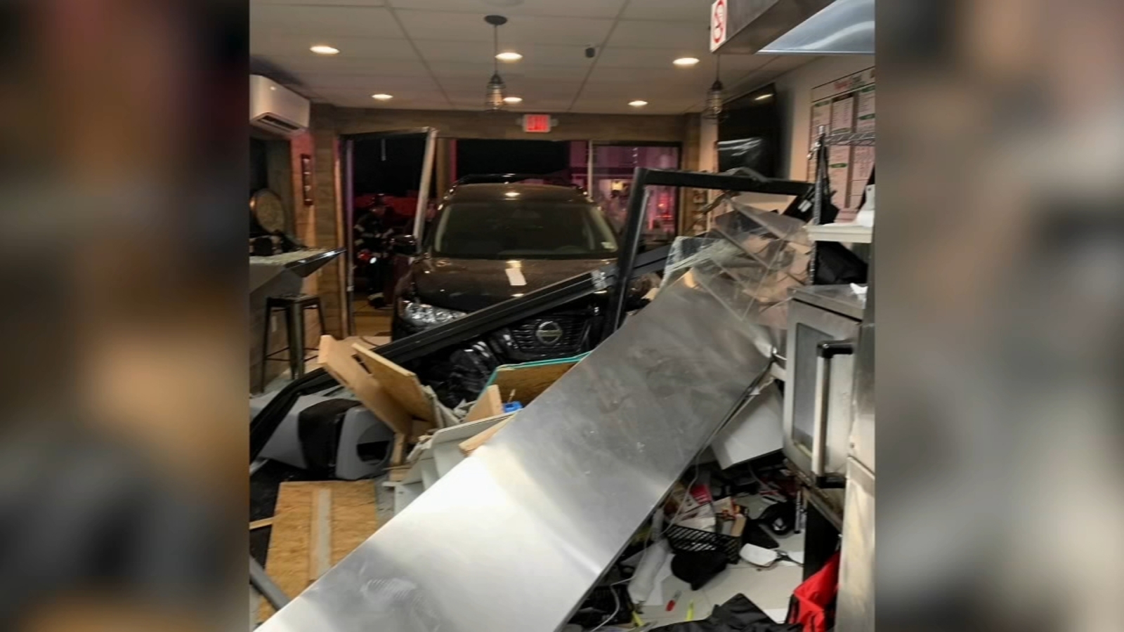 Driver, 3 others injured after car crashes into pizza shop in