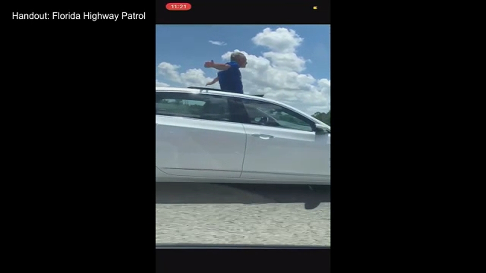 Police: Man, 70, stands through moon roof on highway to 'praise God'