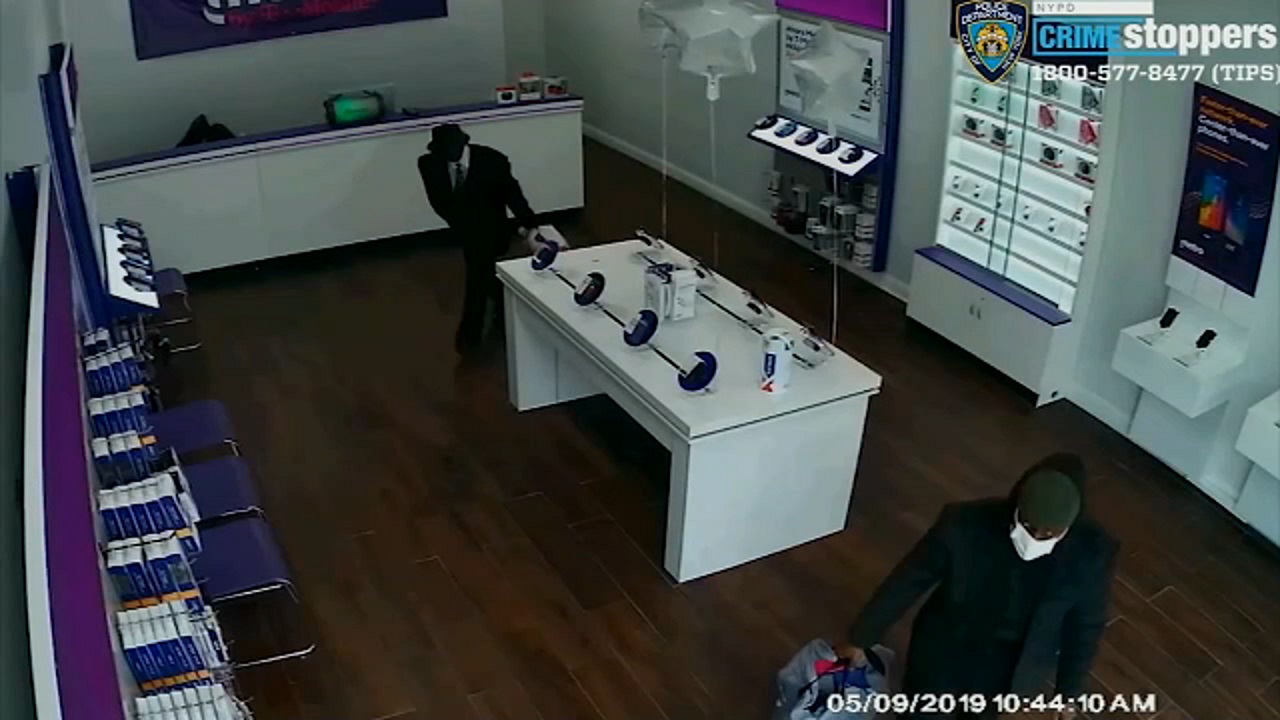 Well-dressed robbers in suits making their way through NYC cellphone stores