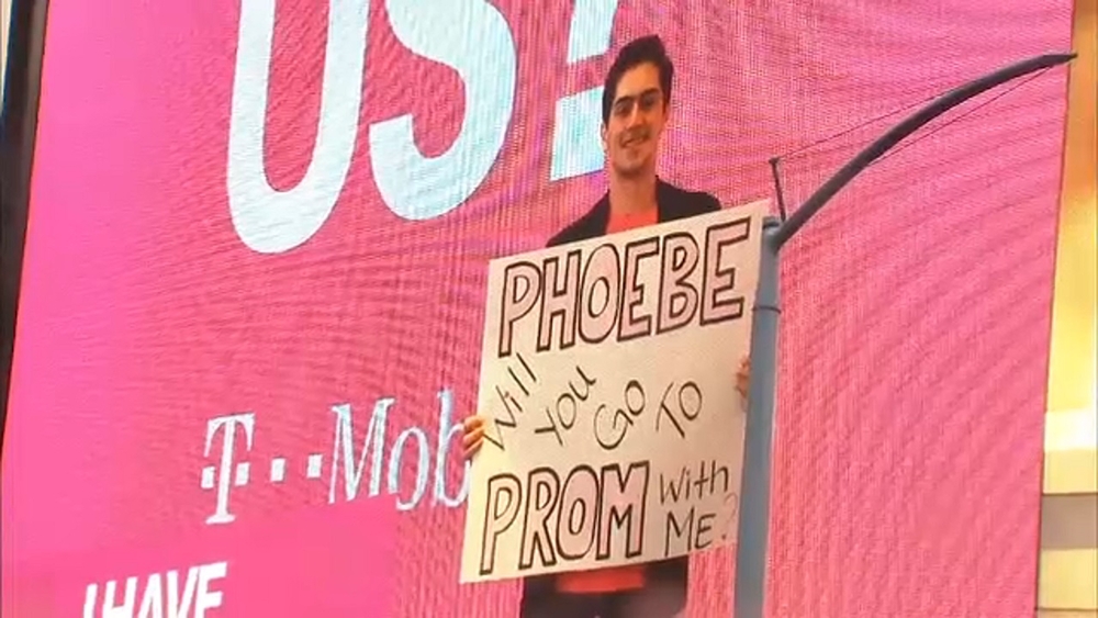High school senior asks girlfriend to prom on Times Square billboard