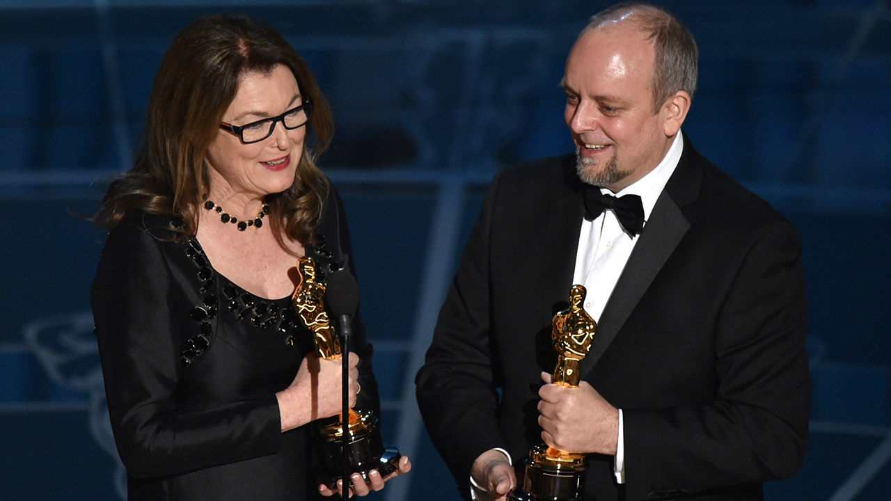 Frances Hannonand Mark Coulier accept the award for Best Makeup and Hairstyling for "The Grand Budapest Hotel."