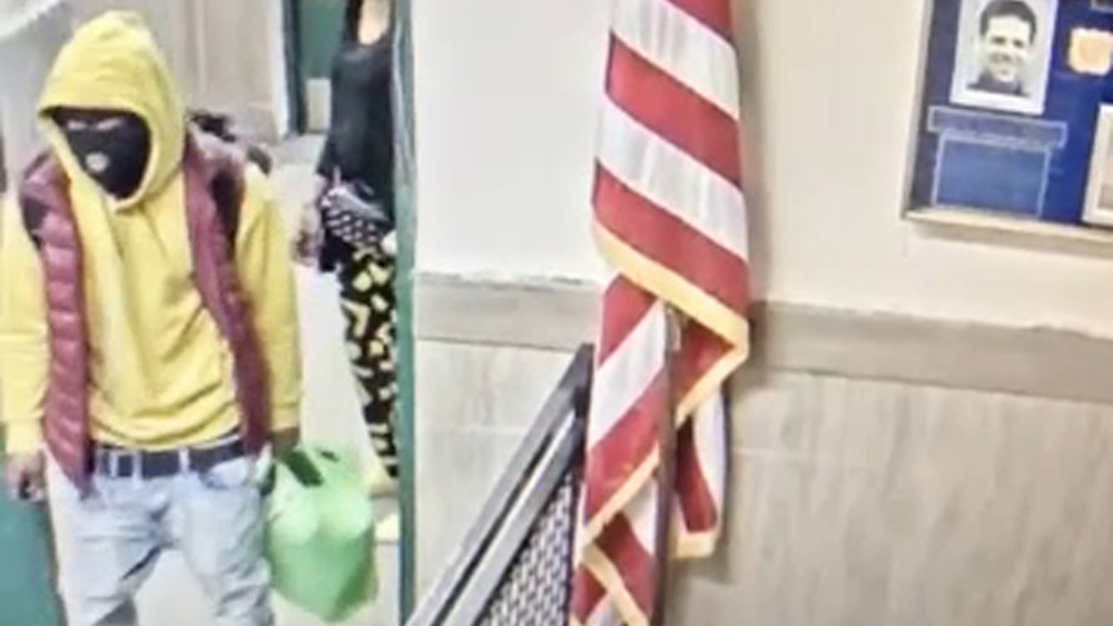 Video captures masked suspect holding 2 knives in Bronx NYPD precinct
