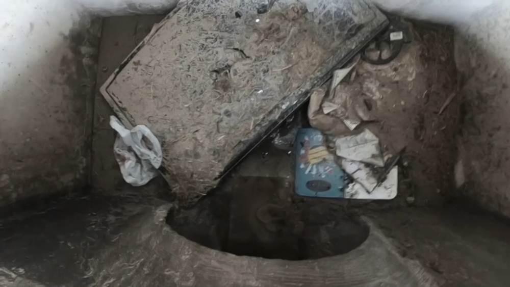 Residents shocked to find big screen TV in street storm drain