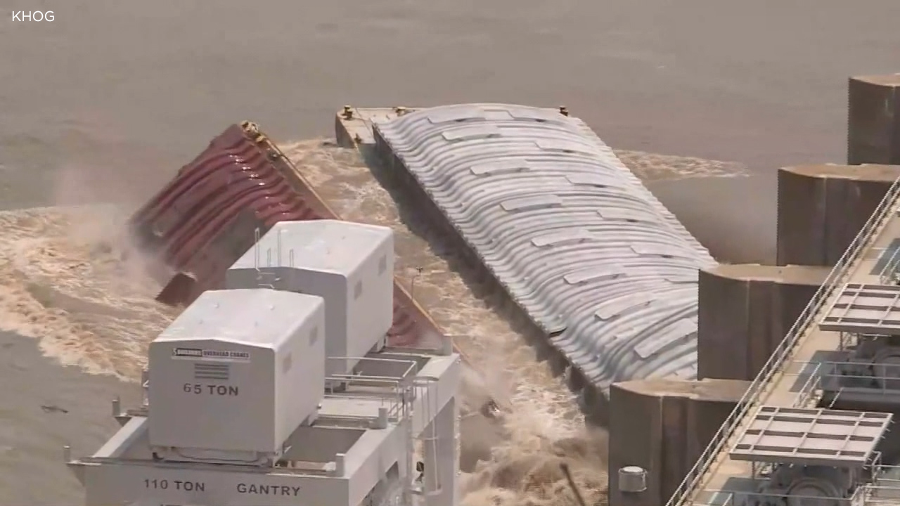 Runaway barges strike dam, at least one sinks