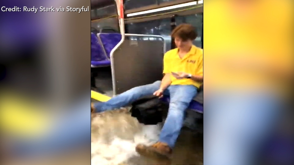 Flood waters sweep through bus as college students ride to class