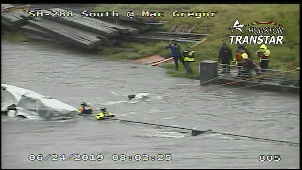Crew pull a man who was stuck in rushing high water to saftey