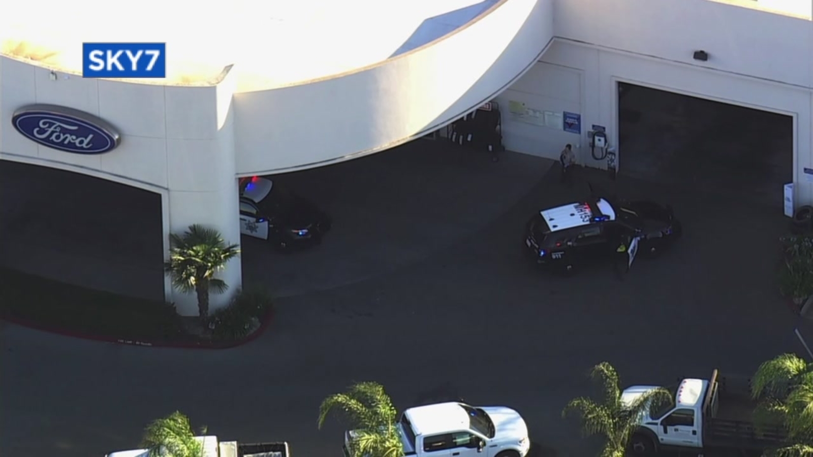 3 people killed, including suspect, in shooting at Ford dealership in