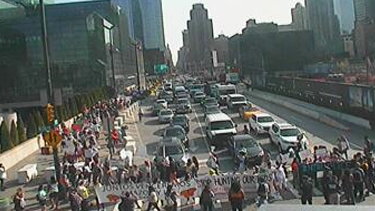 Immigrant rights protesters block traffic, disrupt Amazon conference at Javits Center