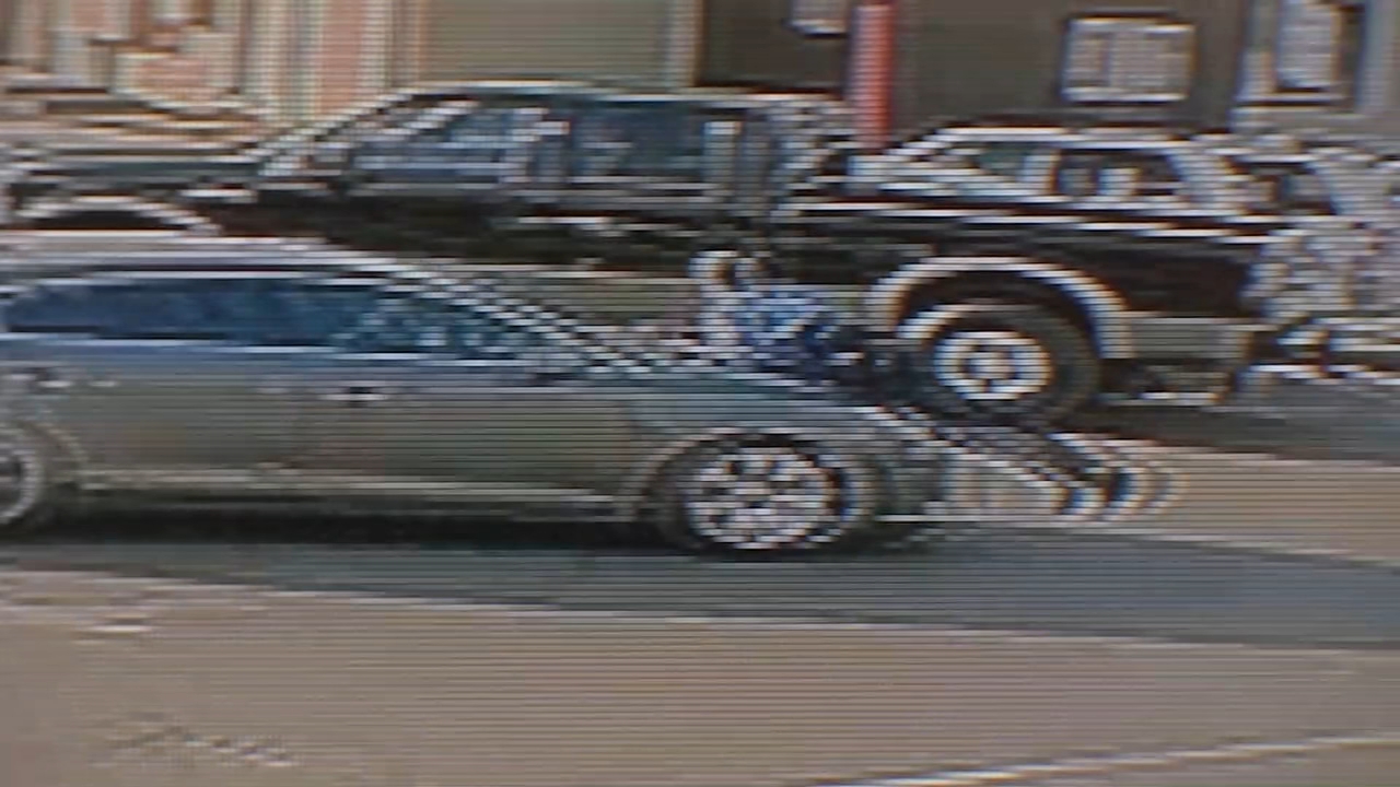 Video shows officer hang on to shoplifting suspect's car