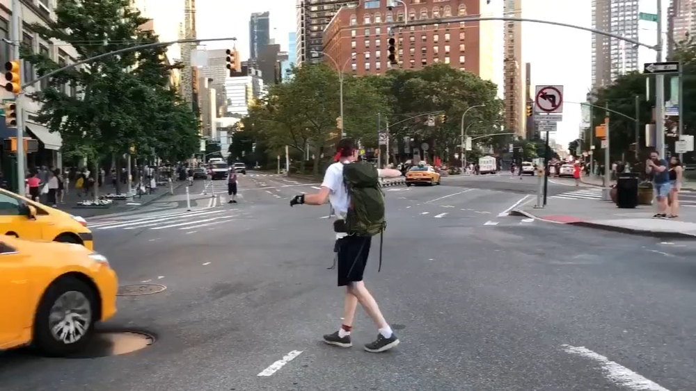 Manhattan Major Power Outage: Citizen directing traffic at Lincoln Center