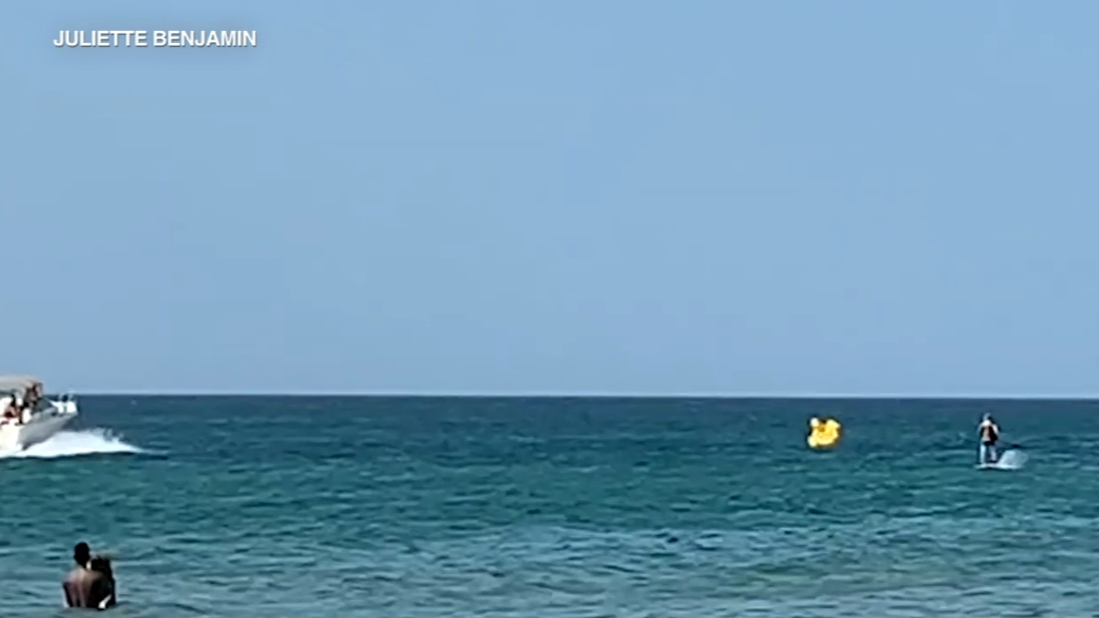 Boater rescues toddler who floated away from shore in inflatable duck ...