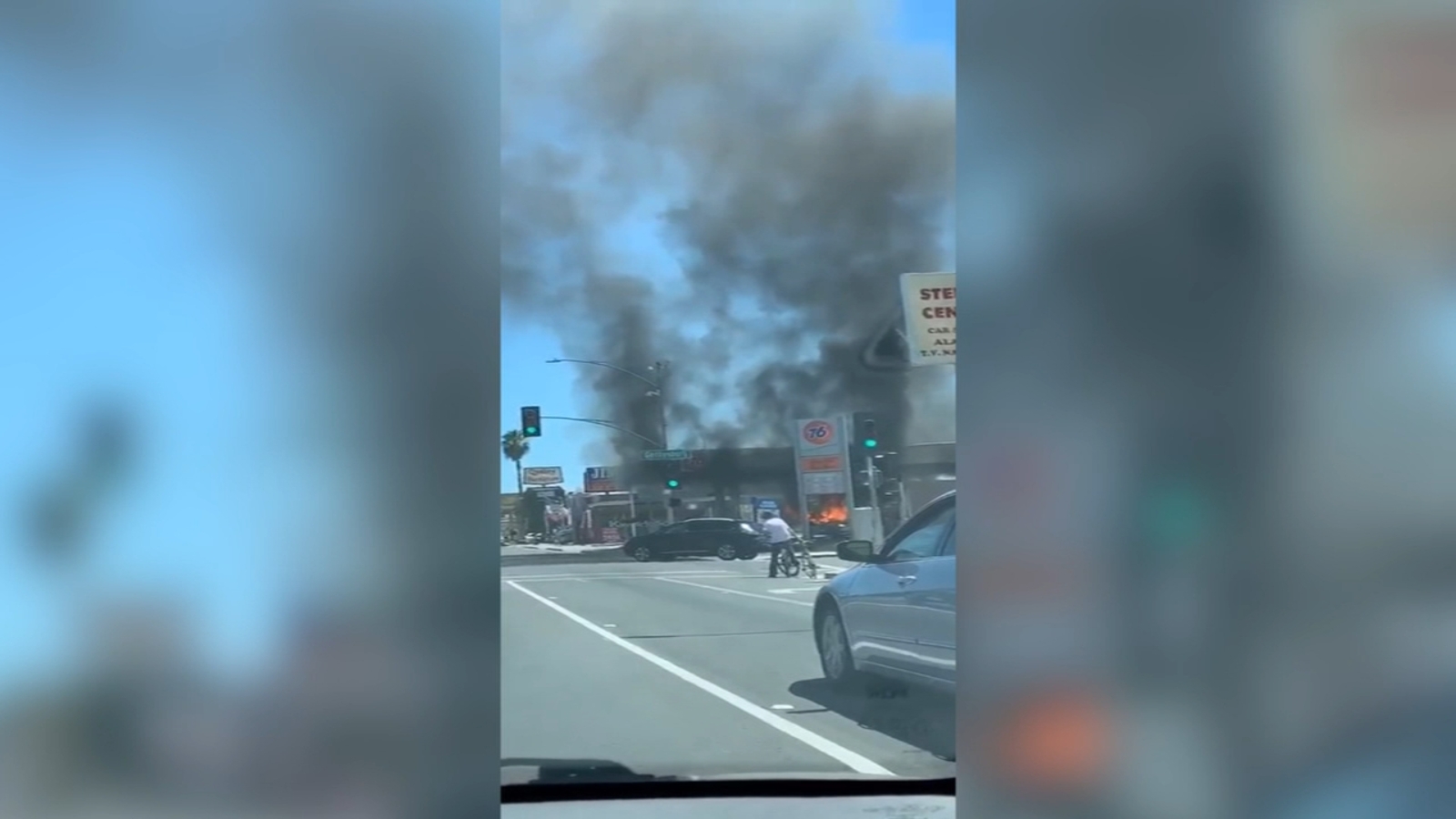 Person injured after car catches fire at northwest Fresno gas station