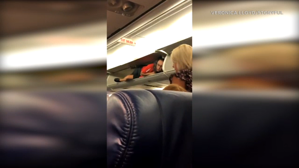 VIDEO: Southwest Airlines flight attendant inside overhead bin 