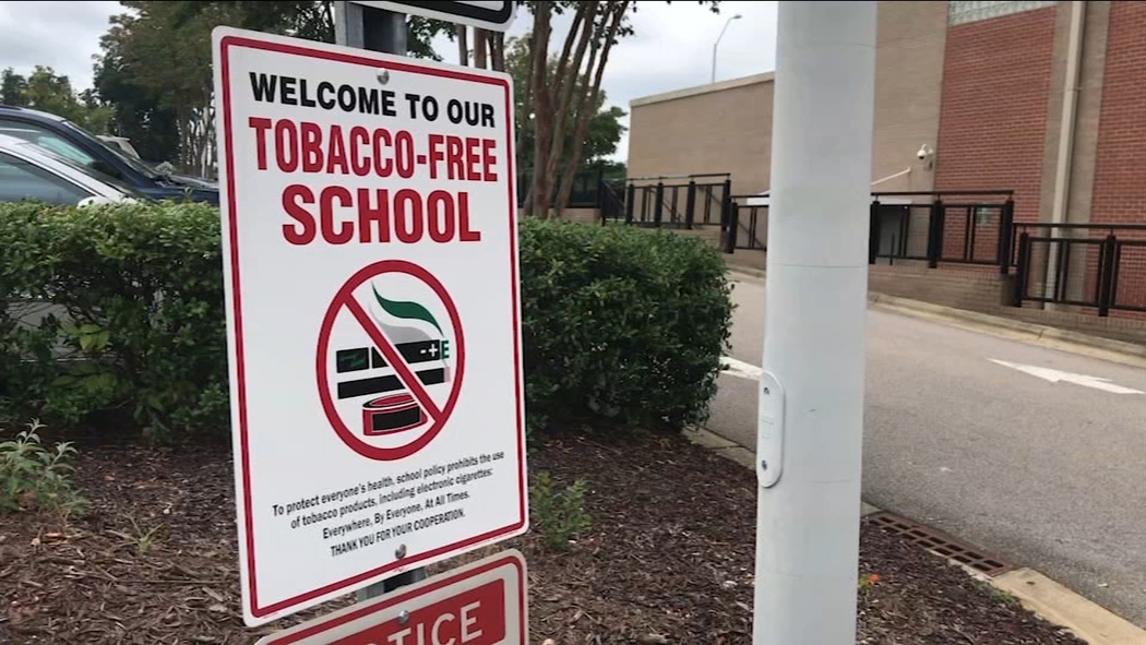 tobacco advertising near schools North Carolina schools add e-cigarette symbol to tobacco-free zone signs