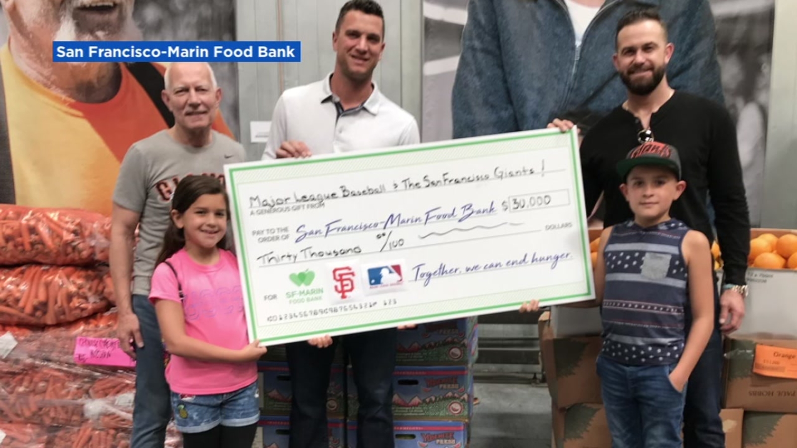 SF Giants' Evan Longoria, Tony Watson deliver 30K check to San