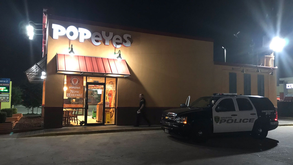 People with gun demand Popeyes chicken sandwiches