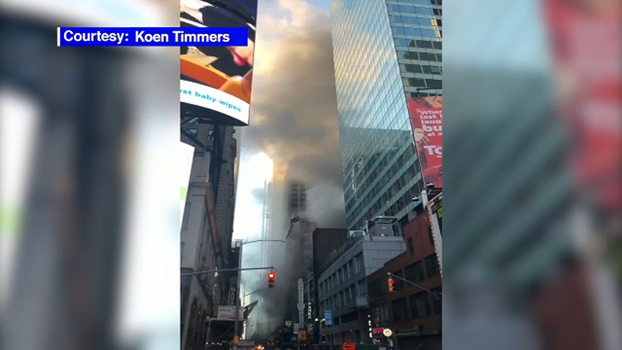 Firefighters battle fire at building in Times Square