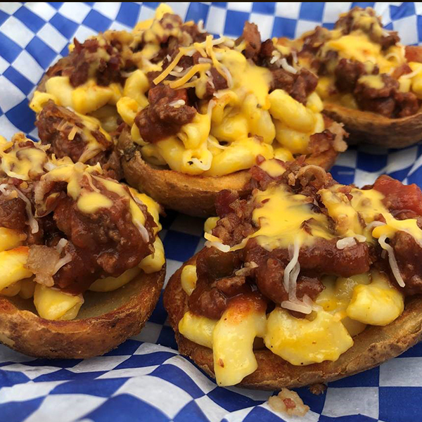 Loaded sloppy joe mac & cheese potato skins topped with bacon, jalapenos and ranch.