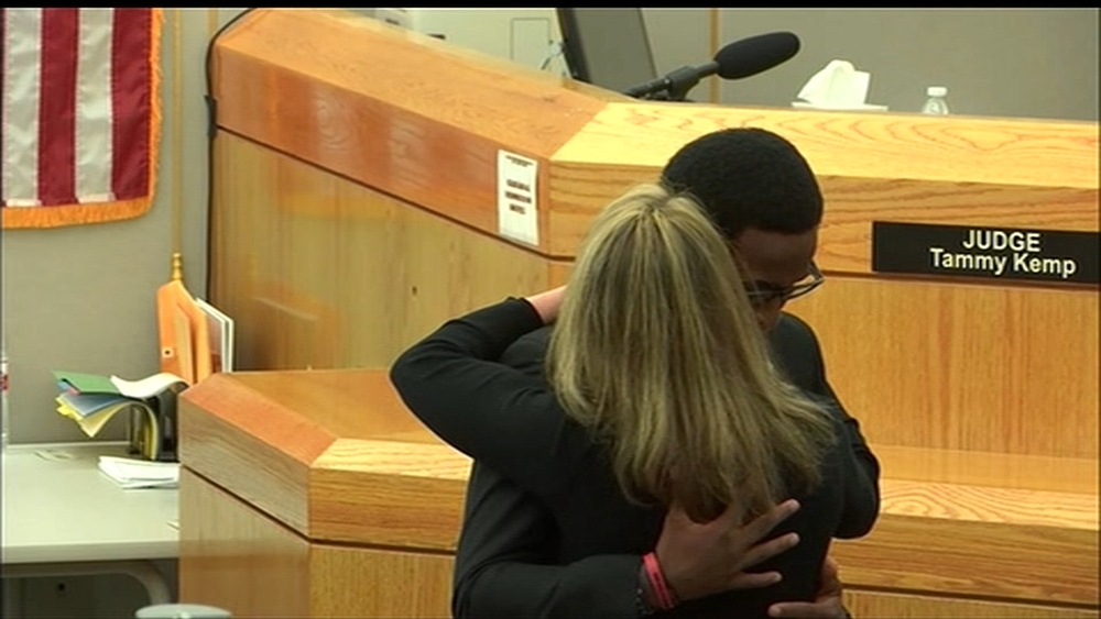Botham Jean's brother hugs Amber Guyger after her sentencing for his brother's murder