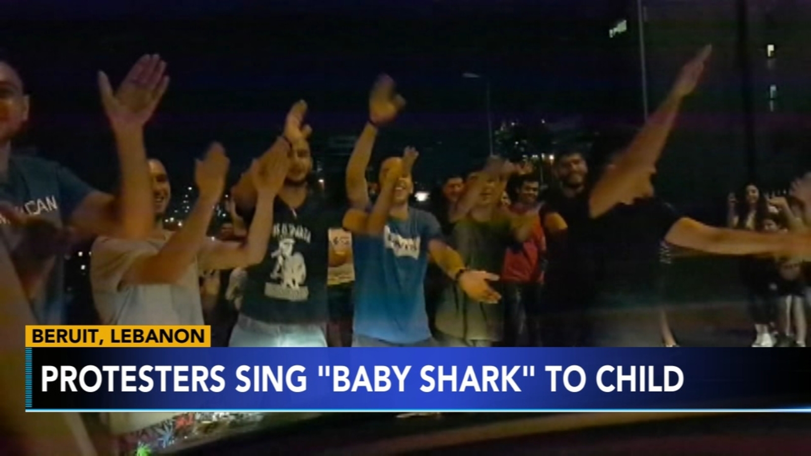 Men sing 'Baby Shark' to child during protest in Lebanon 6abc(01)