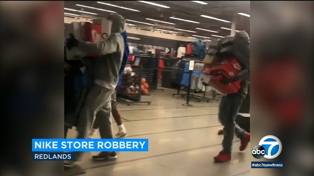 Suspects captured on video robbing Nike store in Redlands