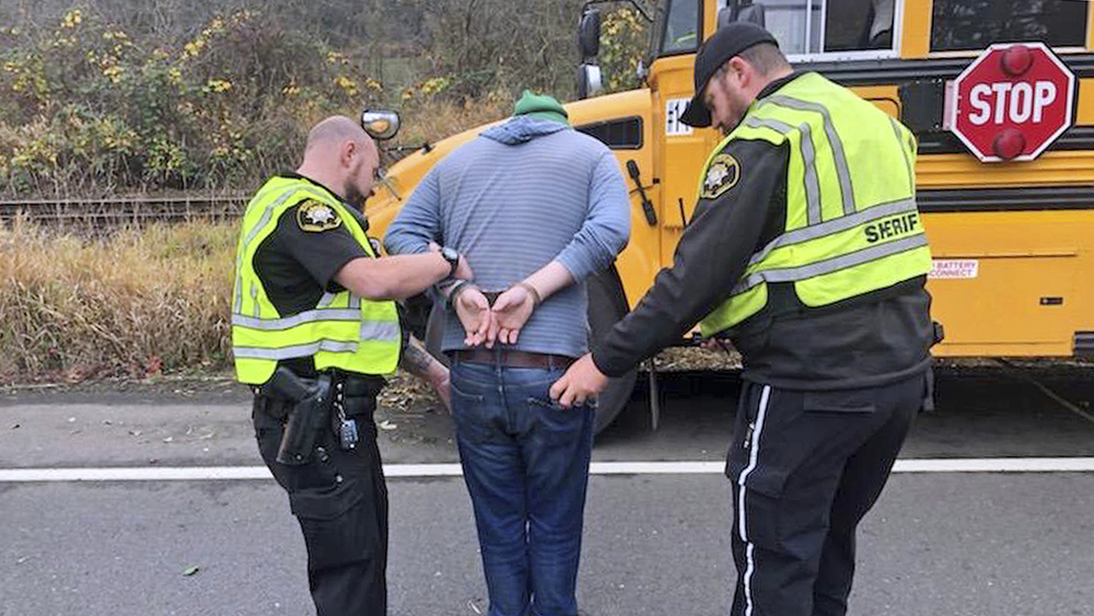 Driver charged with DUI after school bus crashes into ditch