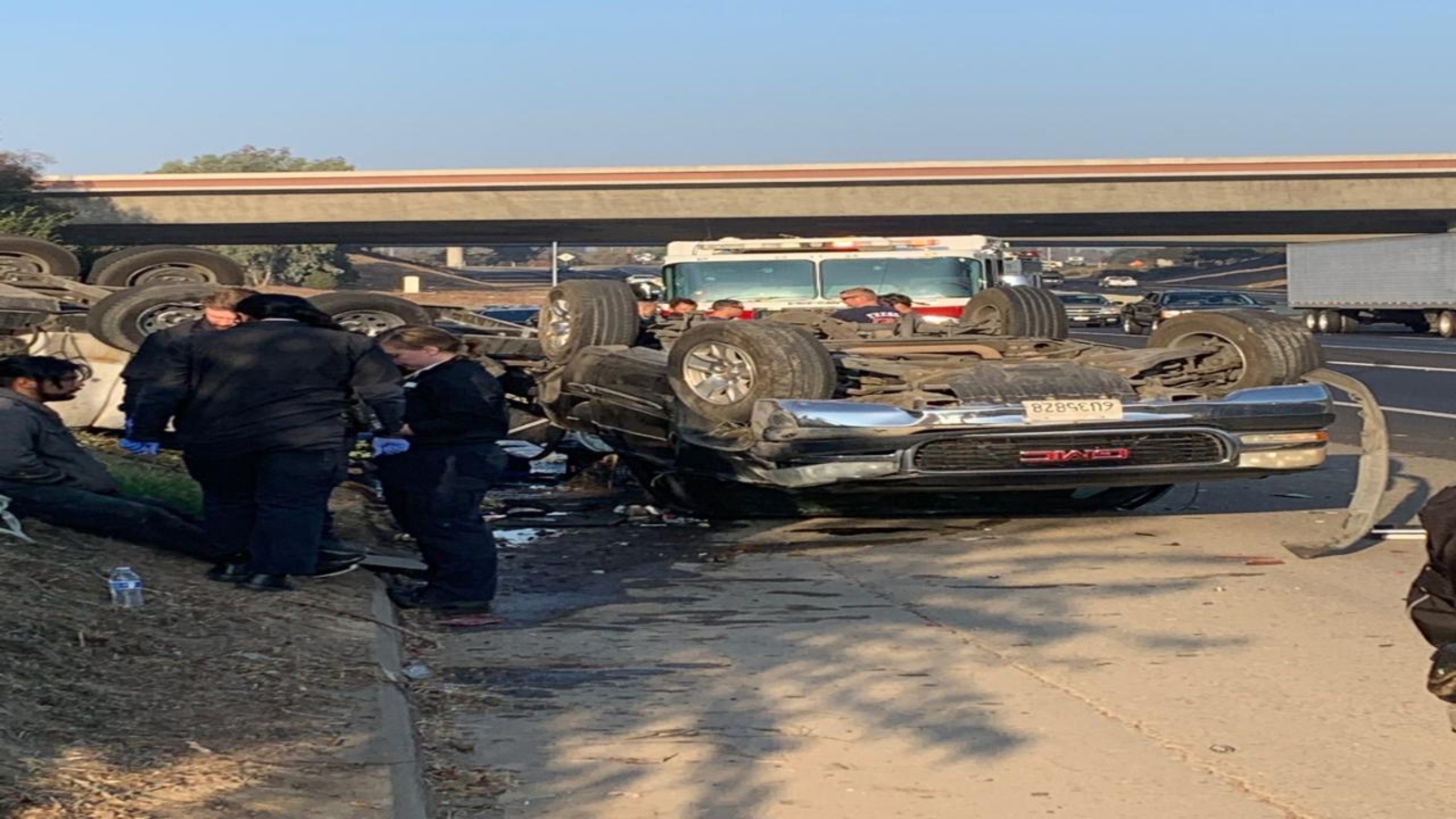 Truck flips on Highway 99, creates HAZMAT scare