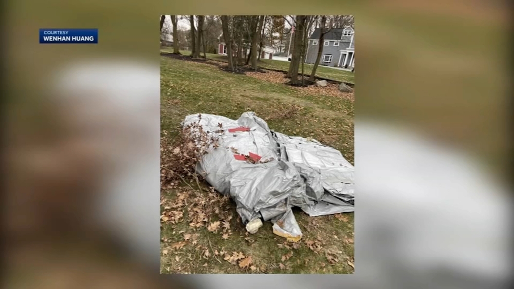 Evacuation slide falls from Delta jet, lands in Boston homeowner's yard