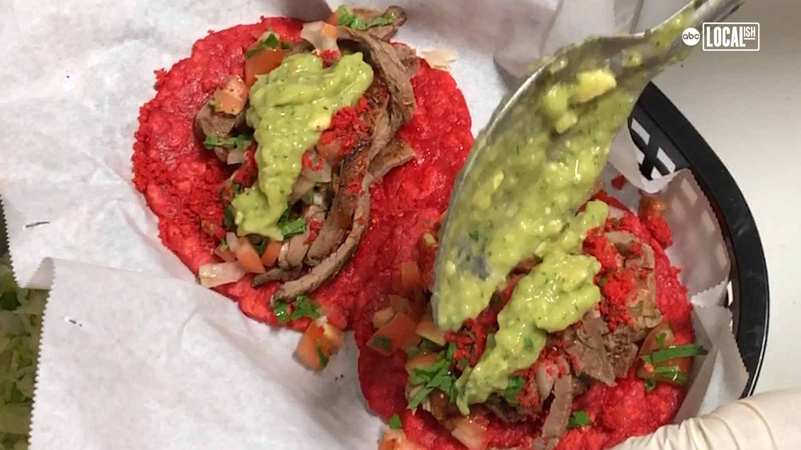 Red tortillas filled with vegetables and guacamole