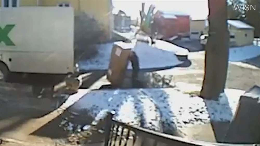 FedEx driver caught on camera swearing, dropping package